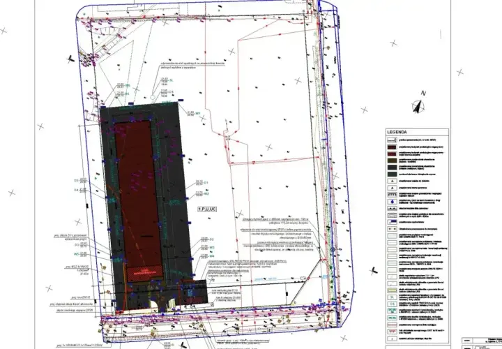 Mapa geodezyjna z naniesionymi elementami infrastruktury. Zastanawiasz się, ile bierze geodeta za wytyczenie działki? Ten dokument to podstawa do takich obliczeń.