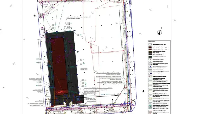Mapa geodezyjna z naniesionymi elementami infrastruktury. Zastanawiasz się, ile bierze geodeta za wytyczenie działki? Ten dokument to podstawa do takich obliczeń.