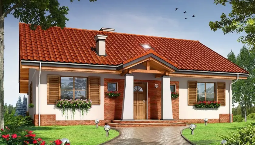 Urokliwy projekt domu Niezapominajka z czerwoną dachówką, białymi kolumnami i drewnianymi okiennicami. Otoczony zielenią i kwiatami.