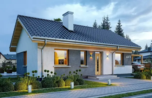 Nowoczesny dom parterowy, projekt domu Kasia 2, z oświetlonym ogrodem i podjazdem.